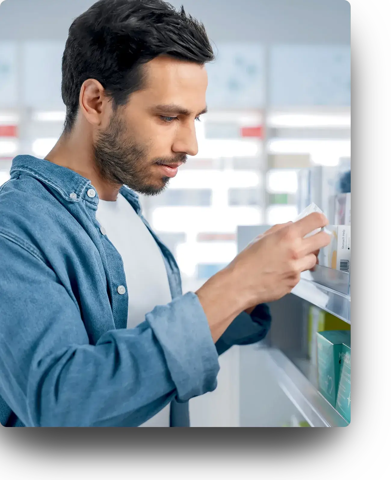 Man selecting sleep aids at a pharmacy 